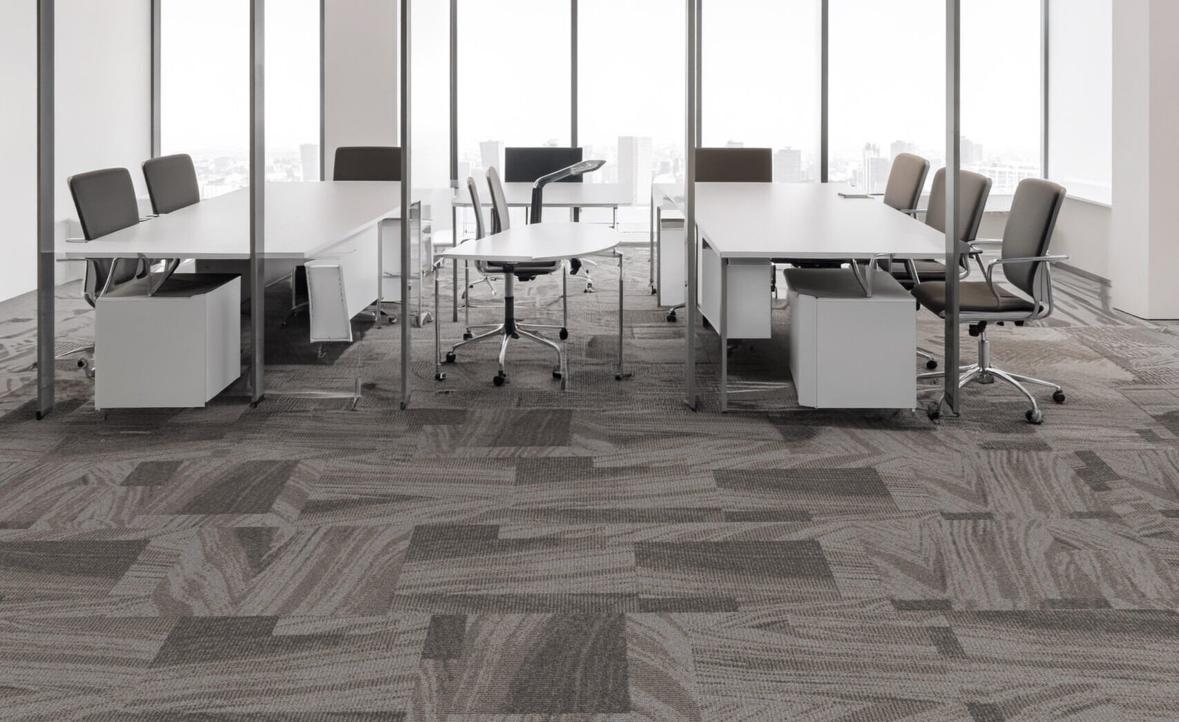 Sea Heights carpet tile with sweeping layered forms inspired by ocean currents, tides and changing coastal landscapes.